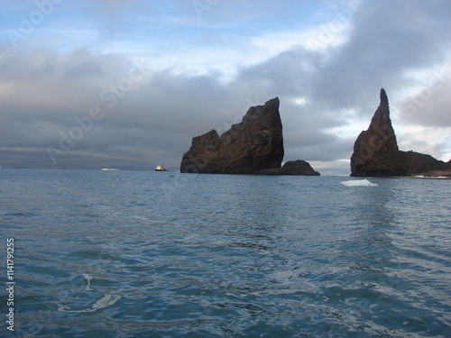 Calm north sea with the cliffs and a ship in a distance photo