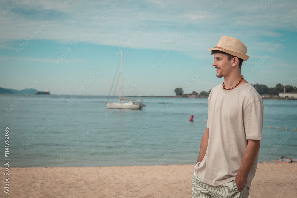 young man with hat walking on the beach young man with hat walking on the beach