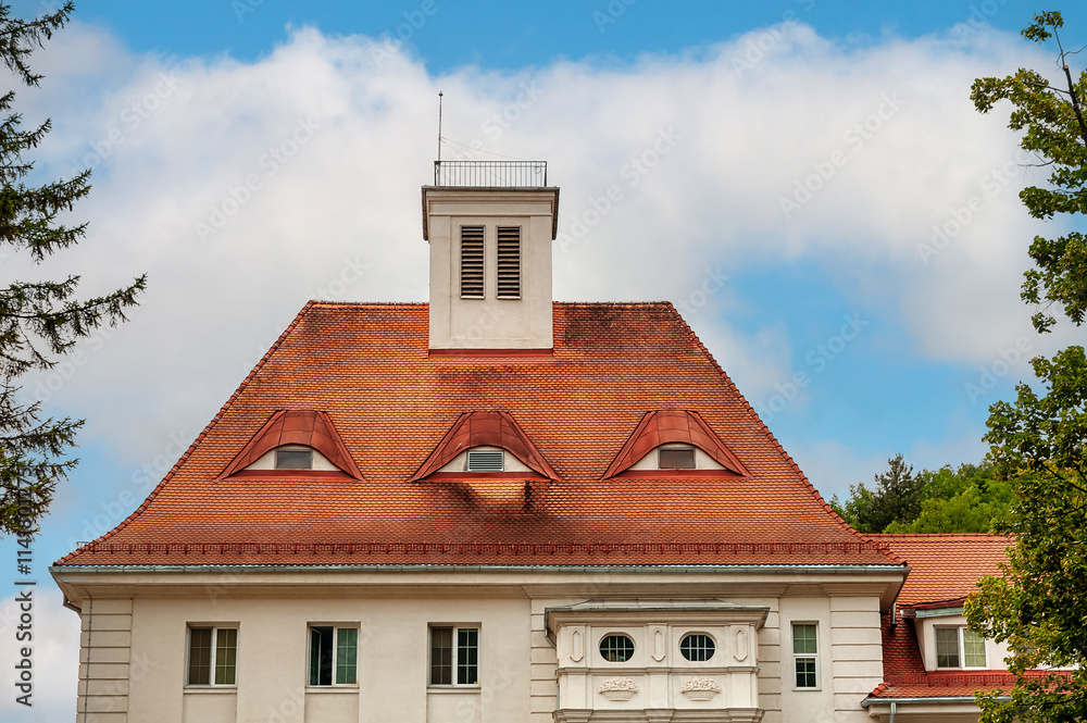 Old house in Brasov with typical roof windows, shaped like eyes, Romania Old house in Brasov with typical roof windows, shaped like eyes, Romania