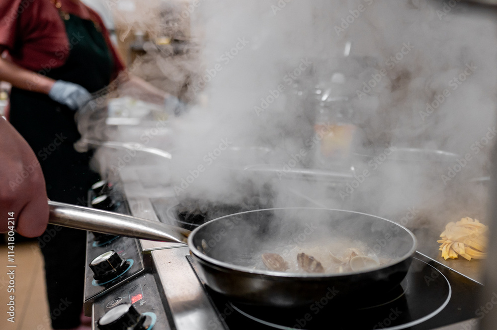 A chef stirs a pan filled with ingredients on a stovetop, surrounded by steam. The kitchen atmosphere is vibrant, showcasing culinary activity and the art of cooking. A chef stirs a pan filled with ingredients on a stovetop, surrounded by steam. The kitchen atmosphere is vibrant, showcasing culinary activity and the art of cooking.