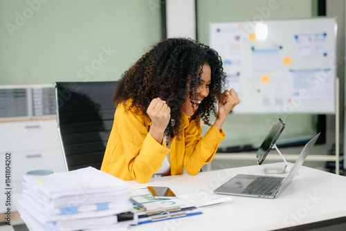 Young businesswoman working with working notepad, tablet and laptop documents talking on the smartphone, tablet photo