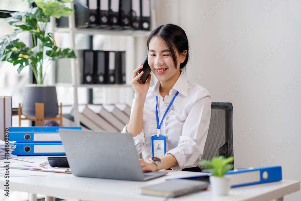 Asian woman entrepreneur busy with her work in the office. Young Asian woman work on desk laptop phone while planning sales, research or financial strategy in company
Asian woman entrepreneur busy with her work in the office. Young Asian woman work on desk laptop phone while planning sales, research or financial strategy in company