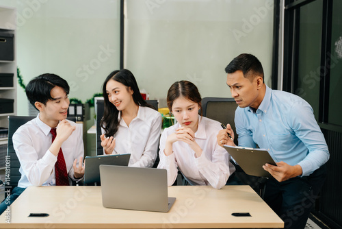 Happy businesspeople while collaborating on a new project in an office. Group of diverse businesspeople