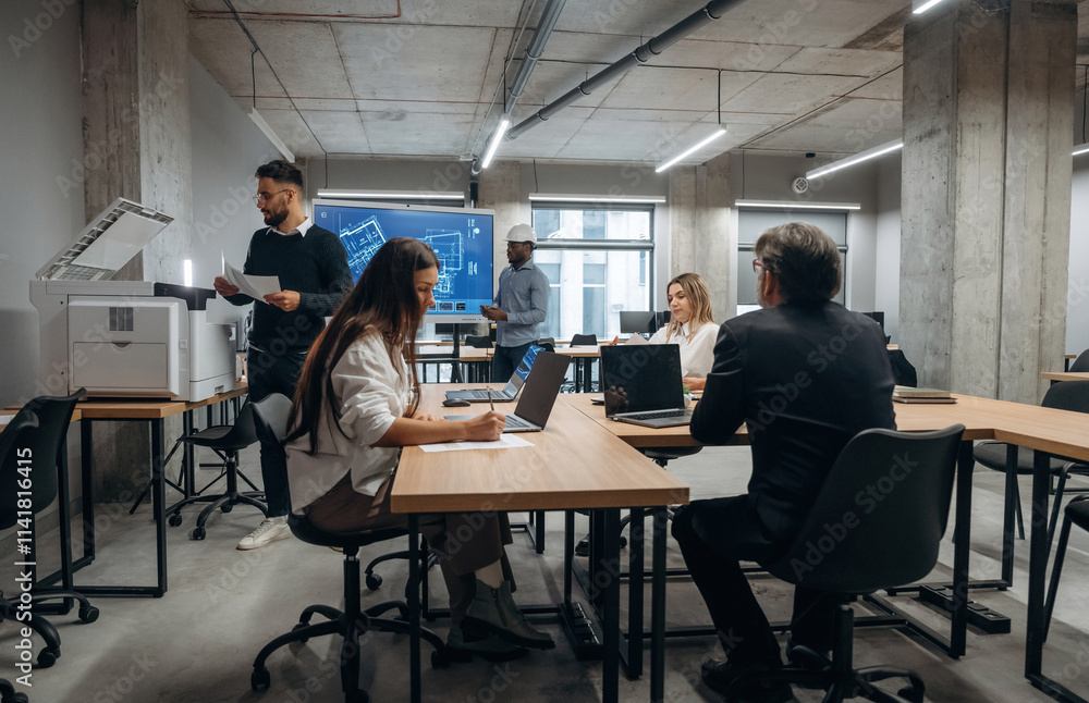In office together. Group of workers are indoors In office together. Group of workers are indoors