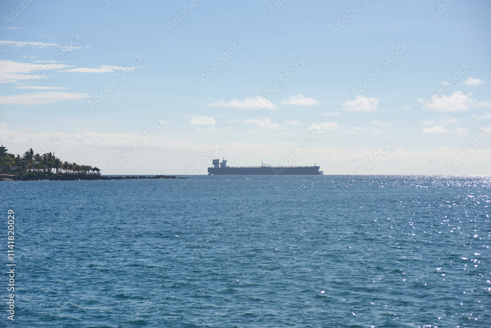 Cargo ship anchored in the high seas near Port Louis, Mauritius Cargo ship anchored in the high seas near Port Louis, Mauritius