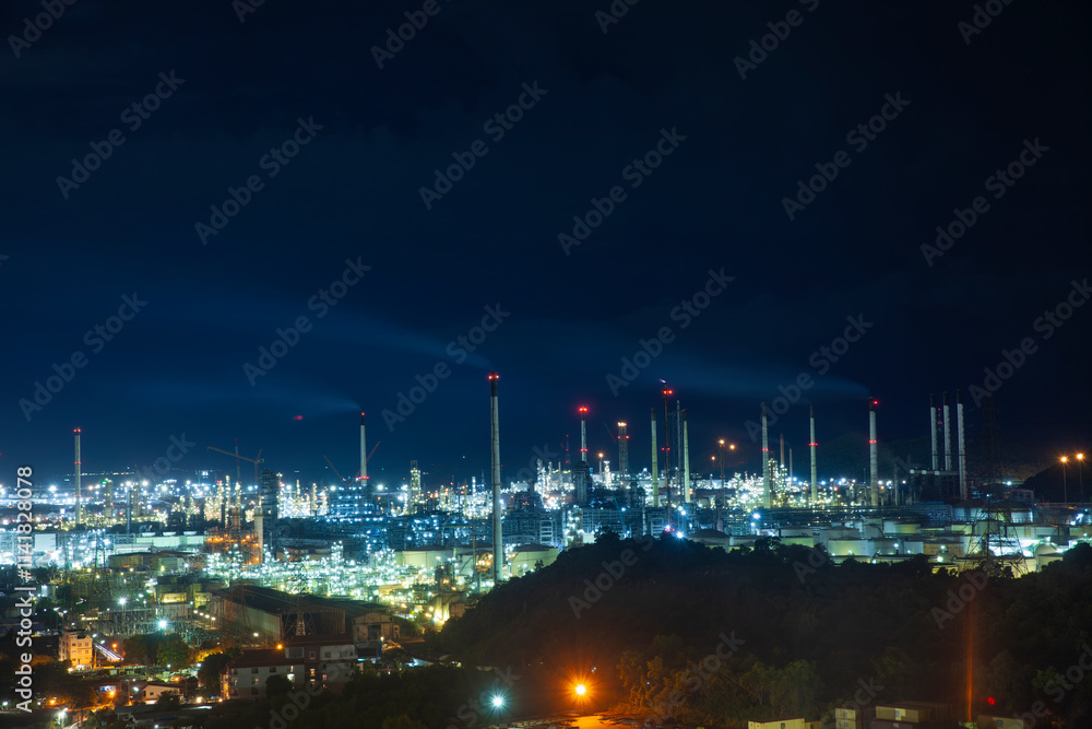 Fototapeta premium Oil and Gas Industrial at night, The oil tank, electricity for industrial oil-refinery plant, large oil refinery.