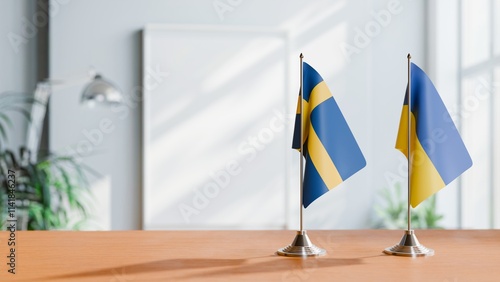 FLAGS OF SWEDEN AND UKRAINE ON TABLE
