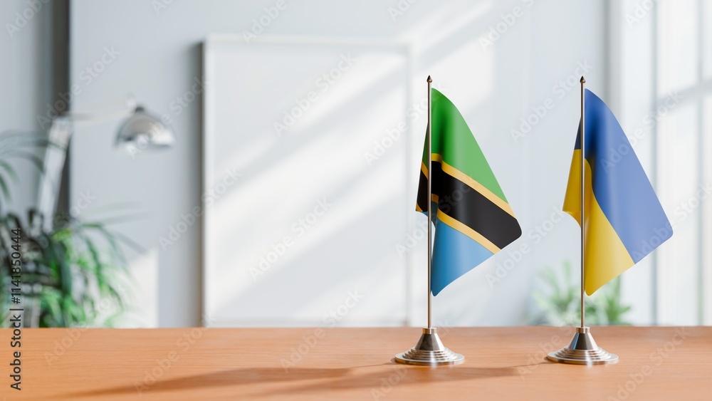 FLAGS OF TANZANIA AND UKRAINE ON TABLE FLAGS OF TANZANIA AND UKRAINE ON TABLE