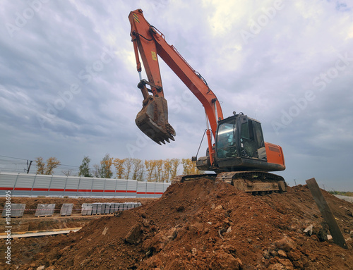 excavator and empty dump truck working at the construction site