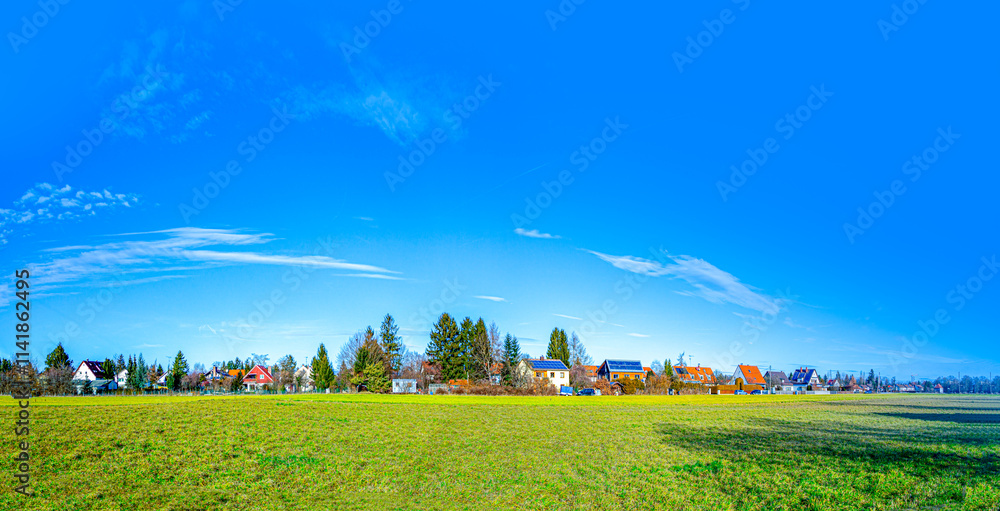 Fototapeta premium suburban area of munich with fields and family houses at horizon, Munich, Germany