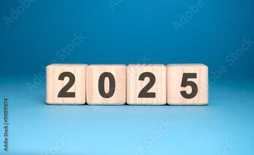 Numbers 2025 on cubes on a blue background