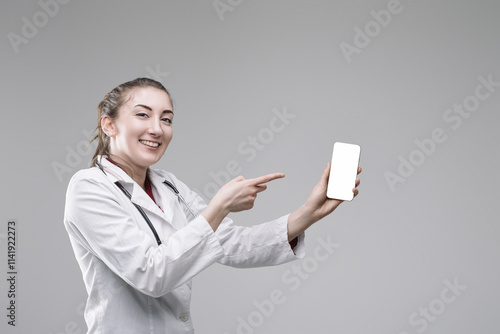 Smiling doctor showing smartphone app for healthcare photo