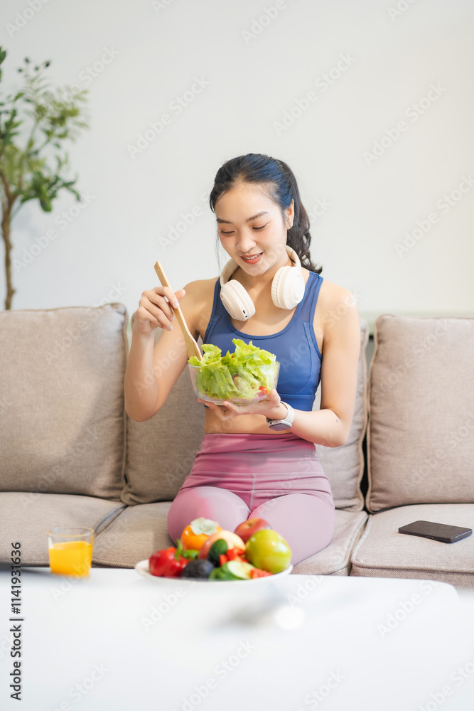 Fit woman enjoys healthy fruit breakfast after yoga training. fitness, nutrition, healthy lifestyle. Fit woman enjoys healthy fruit breakfast after yoga training. fitness, nutrition, healthy lifestyle.