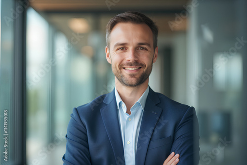 portrait of successful businessman consultant looking at camera and smiling inside modern office building