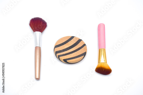 Makeup brushes over a wood background closeup, Cosmetic makeup brush isolated on white background. Blush, eyeshadow contour, foundation, concealer bronzer, angled brushes. Makeup set. Beauty concept. photo