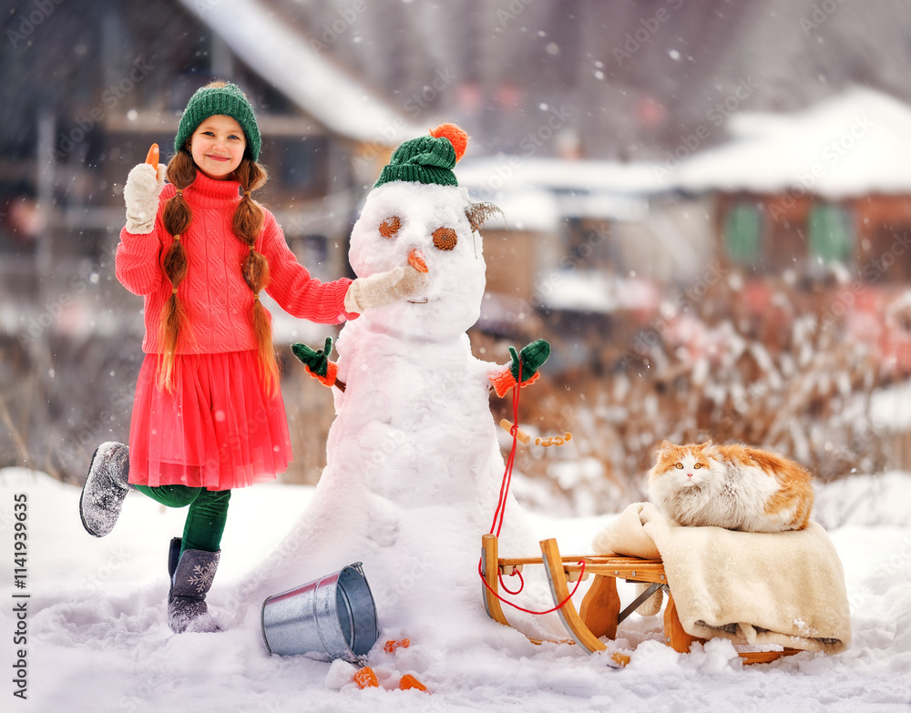 Kid girl makes snowman on winter frosty day. Child makes nose out of carrot. Outdoor family fun on Christmas vacation in the winter new year
