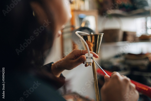 Female entrepreneur repairing electric socket at antique store photo