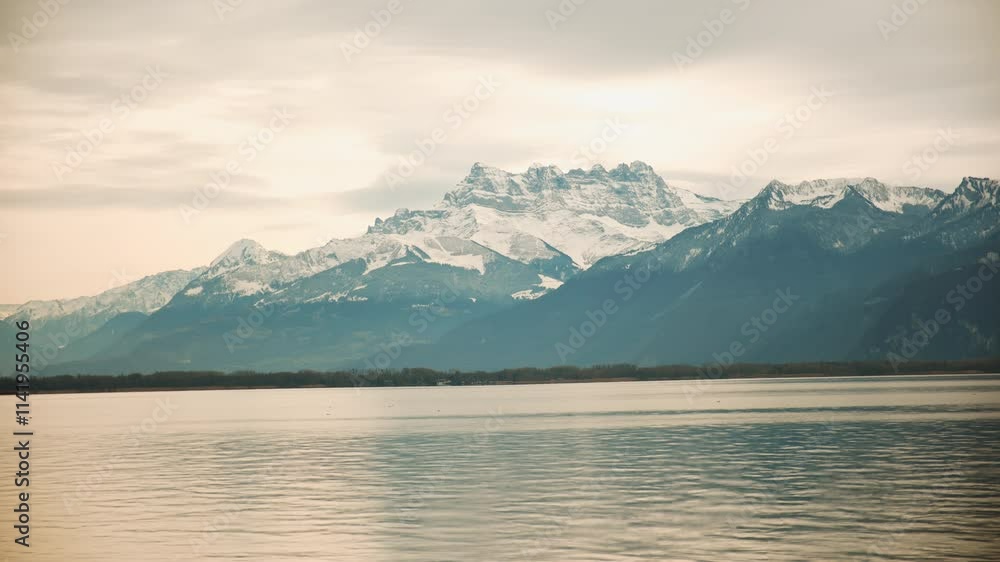 Timelapse of Dents du Midi and Lake Geneva during the day in Canton of Vaud Switzerland Timelapse of Dents du Midi and Lake Geneva during the day in Canton of Vaud Switzerland