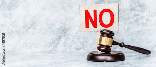 A gavel rests beside a sign that says 