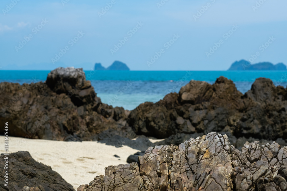 A rocky beach on Koh Samui, Thailand, featuring rugged volcanic rocks, soft sand, and a turquoise sea. A rocky beach on Koh Samui, Thailand, featuring rugged volcanic rocks, soft sand, and a turquoise sea.