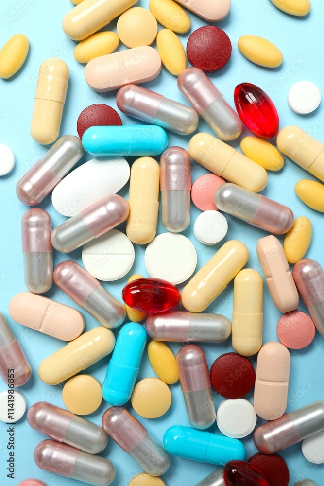 Various tablets and capsules on a colored background Various tablets and capsules on a colored background