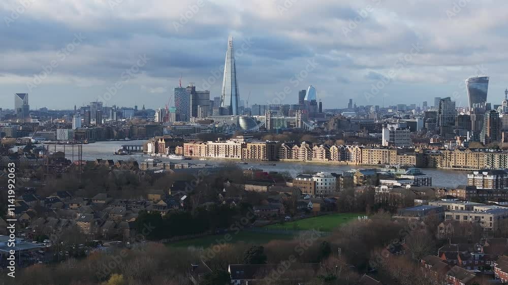 Aerial perspective of London's city district, showcasing skyscrapers, the Gherkin, and the River Thames amidst modern and traditional architecture. Aerial perspective of London's city district, showcasing skyscrapers, the Gherkin, and the River Thames amidst modern and traditional architecture.