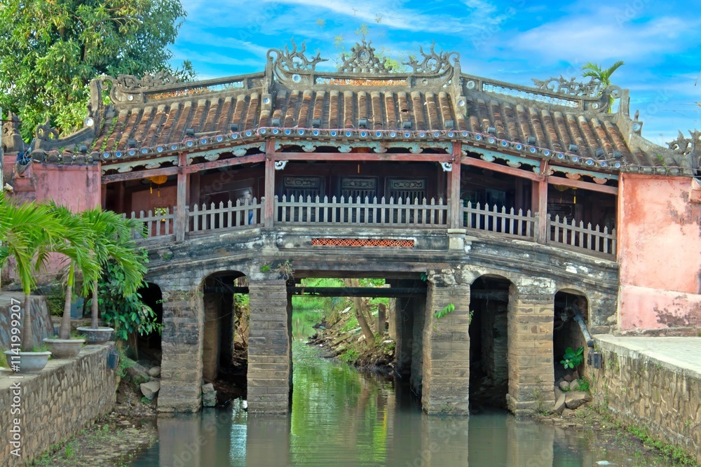 Japanese Bridge in Hoi An, Vietnam, a historic covered bridge with intricate architecture over water Japanese Bridge in Hoi An, Vietnam, a historic covered bridge with intricate architecture over water