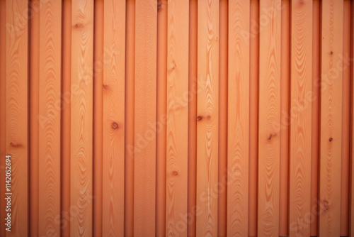 Wooden fence with vertical planks and warm background