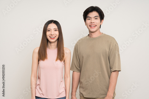 Happy asian couple attractive in various action gesture standing on isolated white background. Cheerful Smiling young man and woman photo