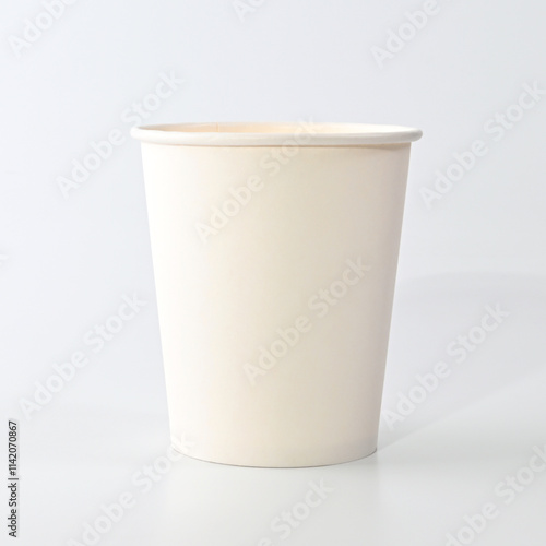 White paper disposable glass for water or coffee or tea on a white background