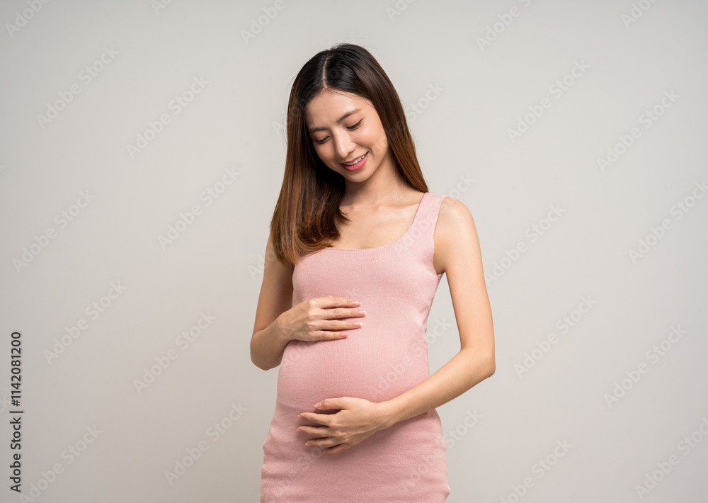 Happy Pregnant asian woman stroking touch belly motherhood on isolated background. Family planning maternity and pregnancy with insurance for child health. Happy Pregnant asian woman stroking touch belly motherhood on isolated background. Family planning maternity and pregnancy with insurance for child health.