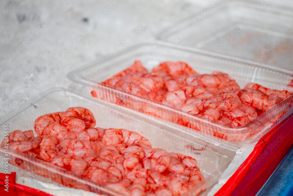 a transparent box is filled with vibrant red shrimp a transparent box is filled with vibrant red shrimp
