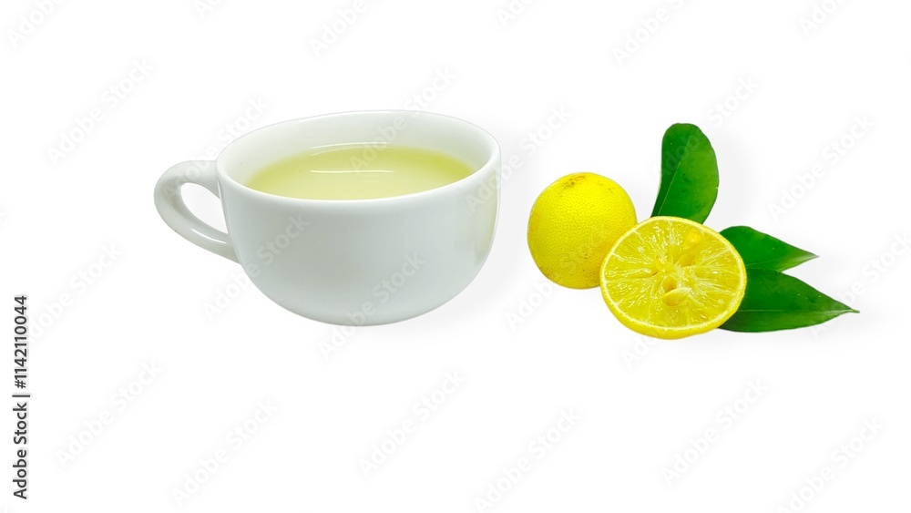 A cup of lemon wedang or lemon tea in a cup and saucer served with lemon slices on a white background. A cup of hot lemon juice for health. A cup of lemon wedang or lemon tea in a cup and saucer served with lemon slices on a white background. A cup of hot lemon juice for health.