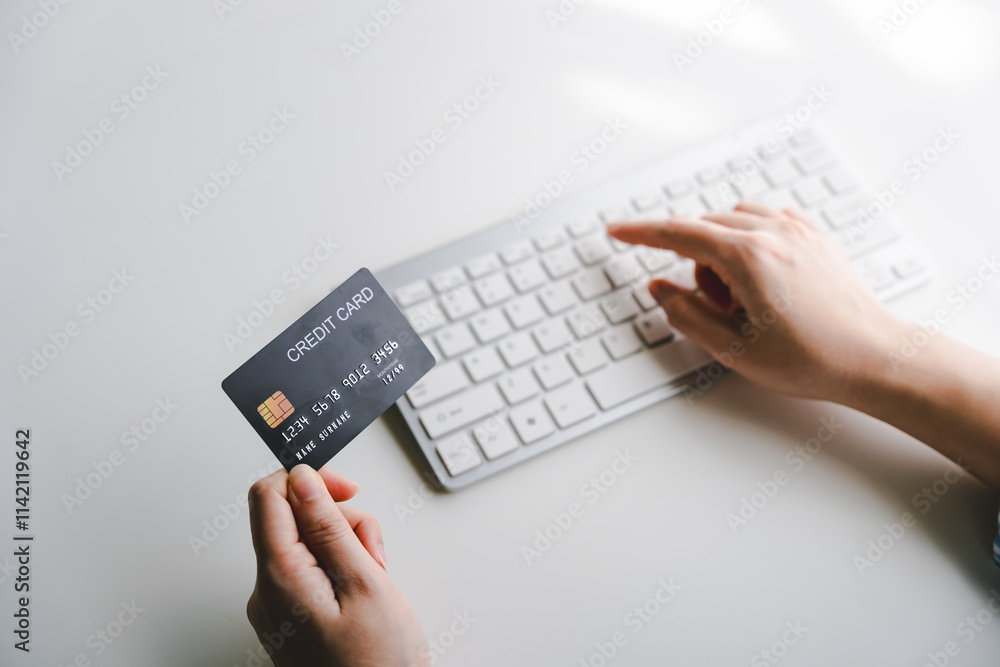 Portrait of entering credit card information on a keyboard, shopping online. Online credit card payment concept Portrait of entering credit card information on a keyboard, shopping online. Online credit card payment concept