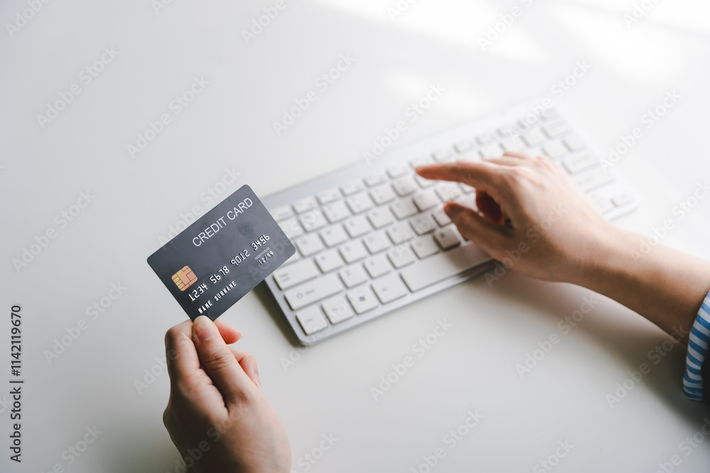Portrait of entering credit card information on a keyboard, shopping online. Online credit card payment concept Portrait of entering credit card information on a keyboard, shopping online. Online credit card payment concept