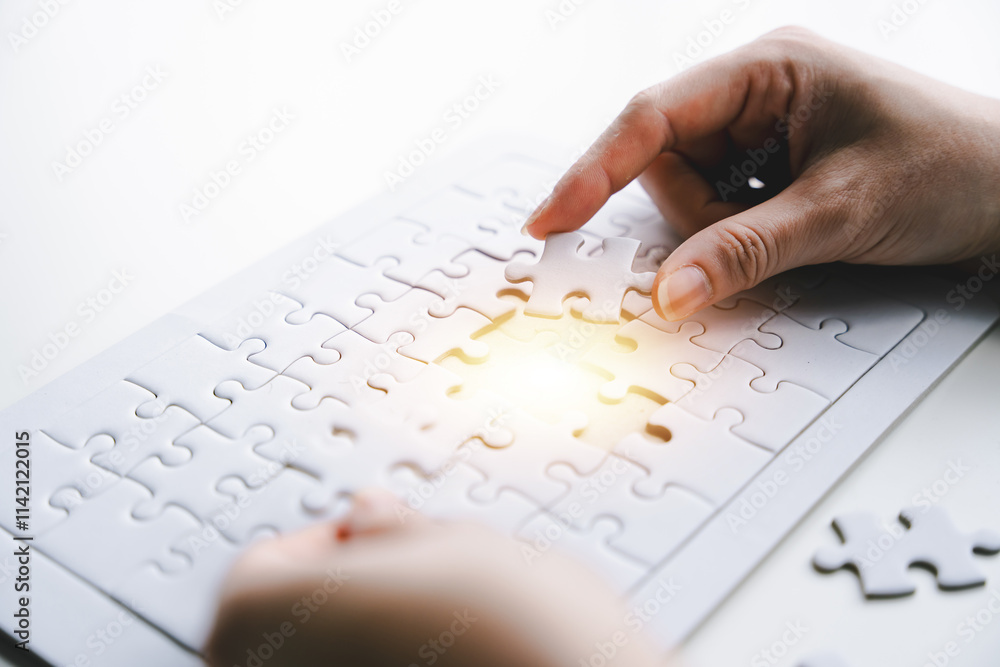 Close-up of business hands connecting with jigsaw puzzle achievements and goals Business concept, strategic planning as a team