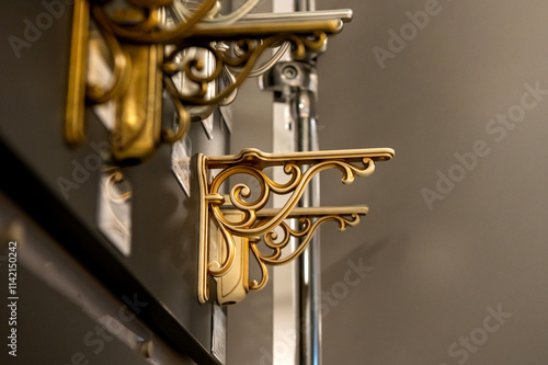 Decorative metal shelf brackets in various styles on display. photo