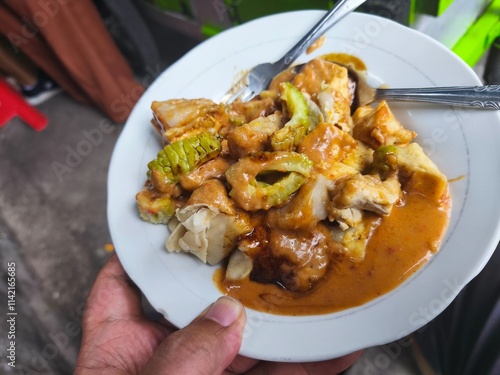 A plate of Batagor, a popular Indonesian street food. photo