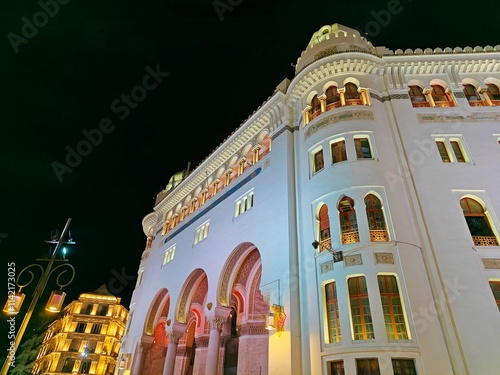 Night view of the illuminated upper part of the Algiers Central Post Office, a historic building in the city center og Algiers. Algeria