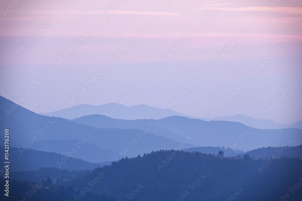 Mountain range under gradient sky at dawn or dusk Mountain range under gradient sky at dawn or dusk