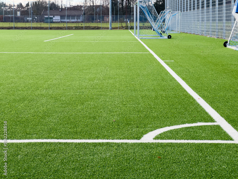 Fototapeta premium Empty part Soccer pitch from a corners view with a goal