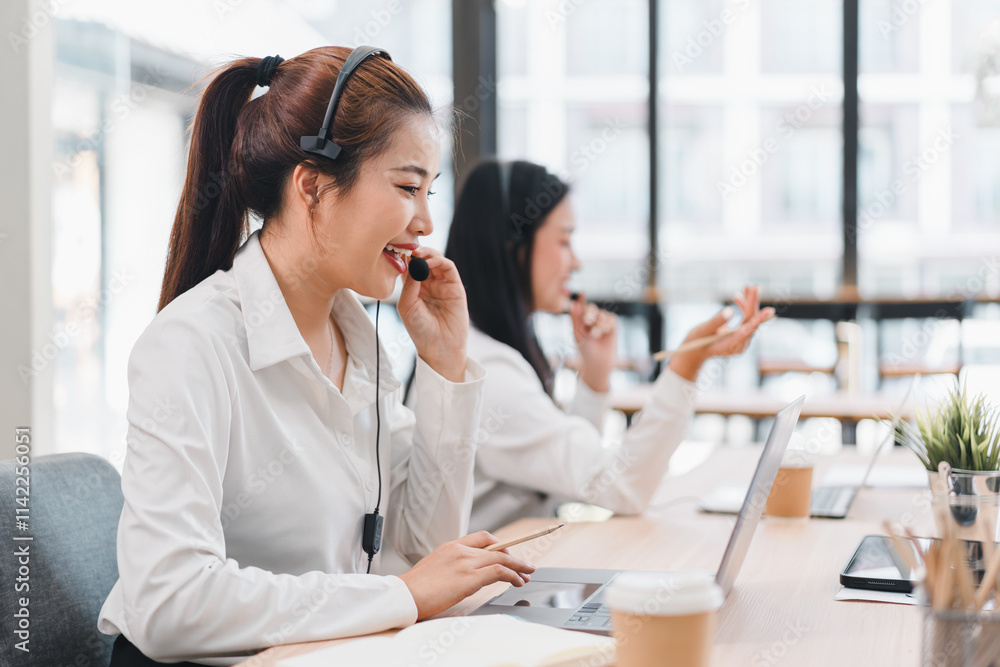 Customer service representatives working with headsets Customer service representatives working with headsets