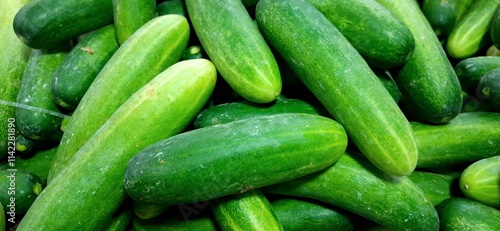 Fresh green cucumbers fruit or timun background for sale at traditional market