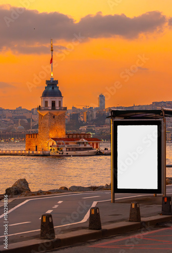Obraz na płótnie Maiden's Tower in the background and bus stop advertising board in the at sunset, Istanbul, Turkey w salonie