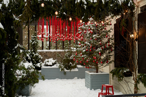 Wallpaper Mural A lot of red balloons, New Year's street decoration. Christmas tree and ribbons. Snow decoration of the New Year holidays. Torontodigital.ca