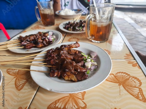 A feast of Sate Kambing or goat satay awaits. photo