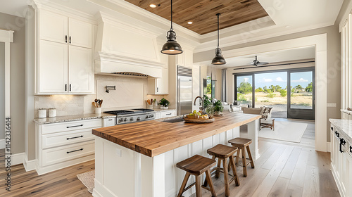 A large kitchen with a wooden island and a countertop. The kitchen is well-lit and has a modern feel