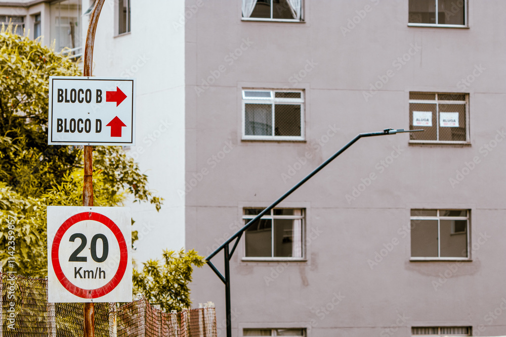 Naklejka premium Traffic signs indicating the maximum permitted speed and identification of apartment blocks within the condominium 1