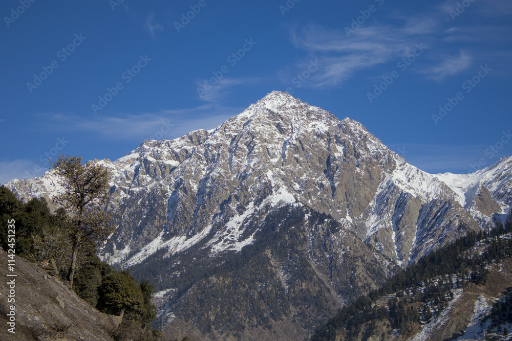 Majestic Snow-Covered Mountain Peak with Forest in Kalam, Pakistan Majestic Snow-Covered Mountain Peak with Forest in Kalam, Pakistan
