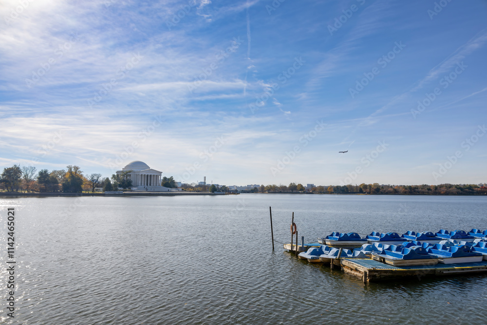 Scenic view of the Jefferson Memorial reflected in the Tidal Basin under a clear blue sky in Washington, DC. Scenic view of the Jefferson Memorial reflected in the Tidal Basin under a clear blue sky in Washington, DC.